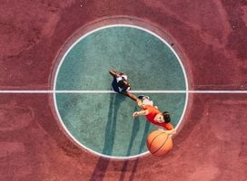 Two men playing basketball.